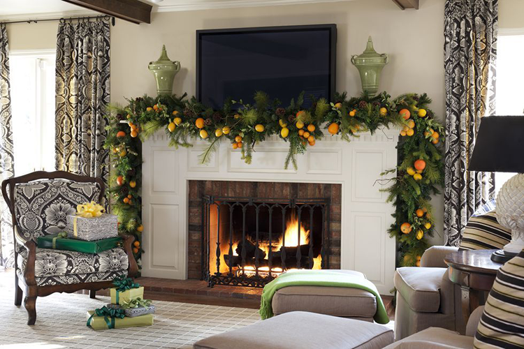 Green garland with lemons and oranges